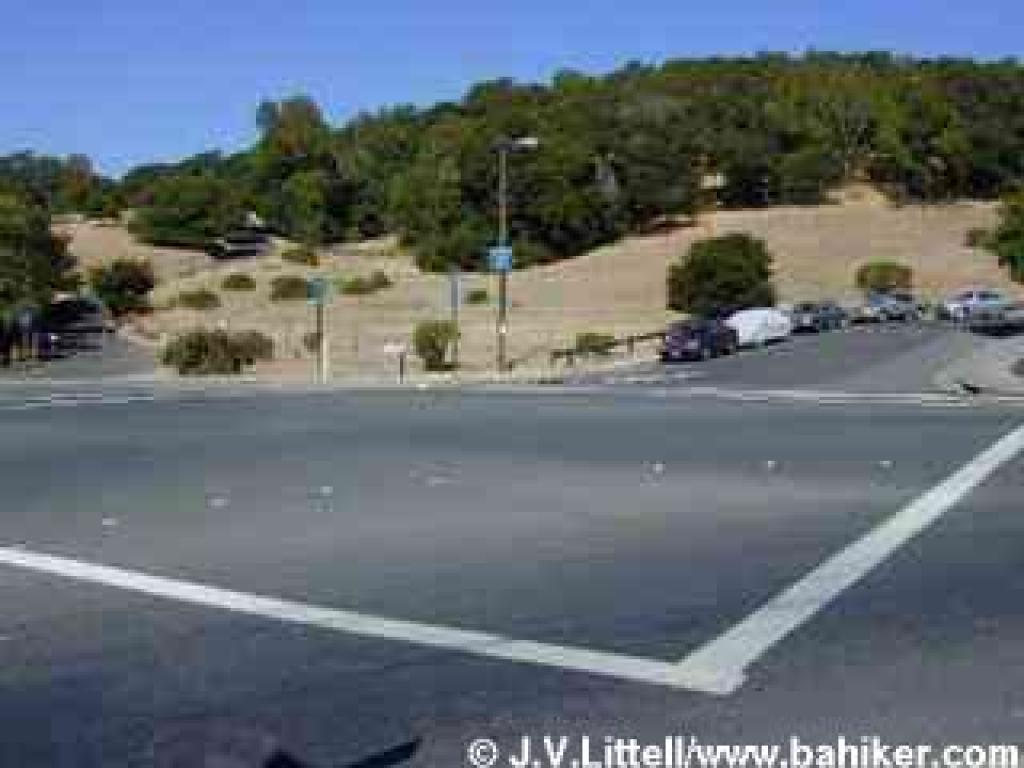 Chicken Shack Fire Road starts to the left; Clay Court on the right offers side of the road parking