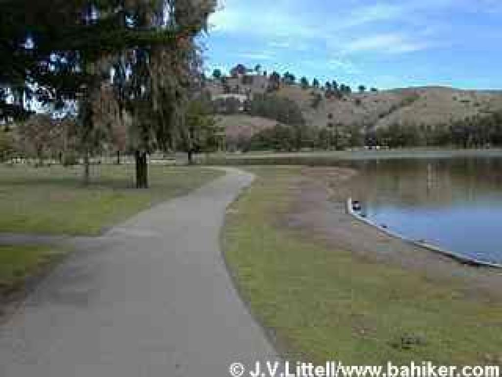 A paved path skirts the lagoon